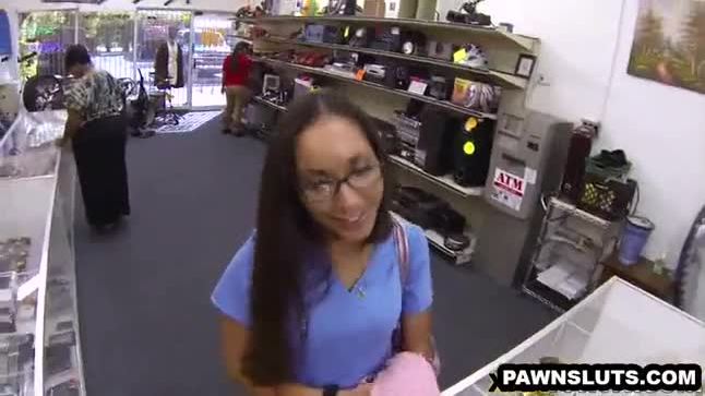 Geeky brunette babe trying to get a deal at the pawn shop