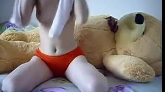 Teen rides a teddybear